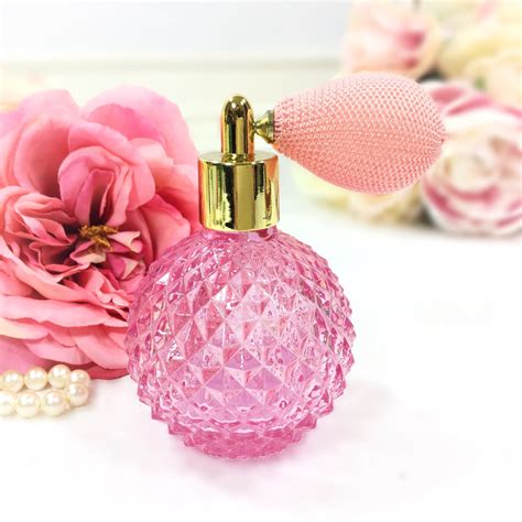 perfume pink diamond shaped bottle.